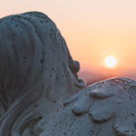 Canva-Angelic-Statue-and-Sunset-Scenery
